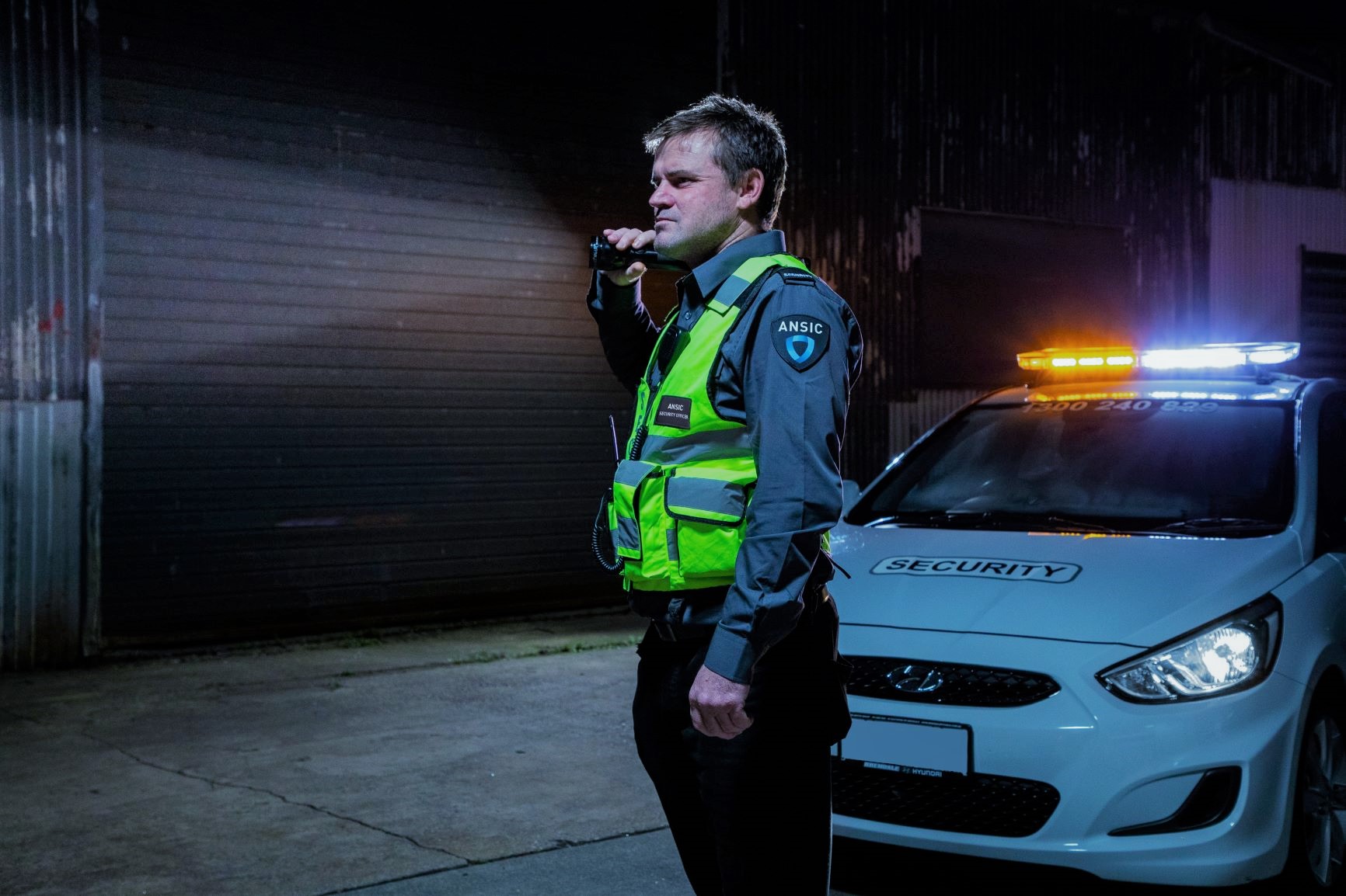 ANSIC officer on night patrol inside an industrial building