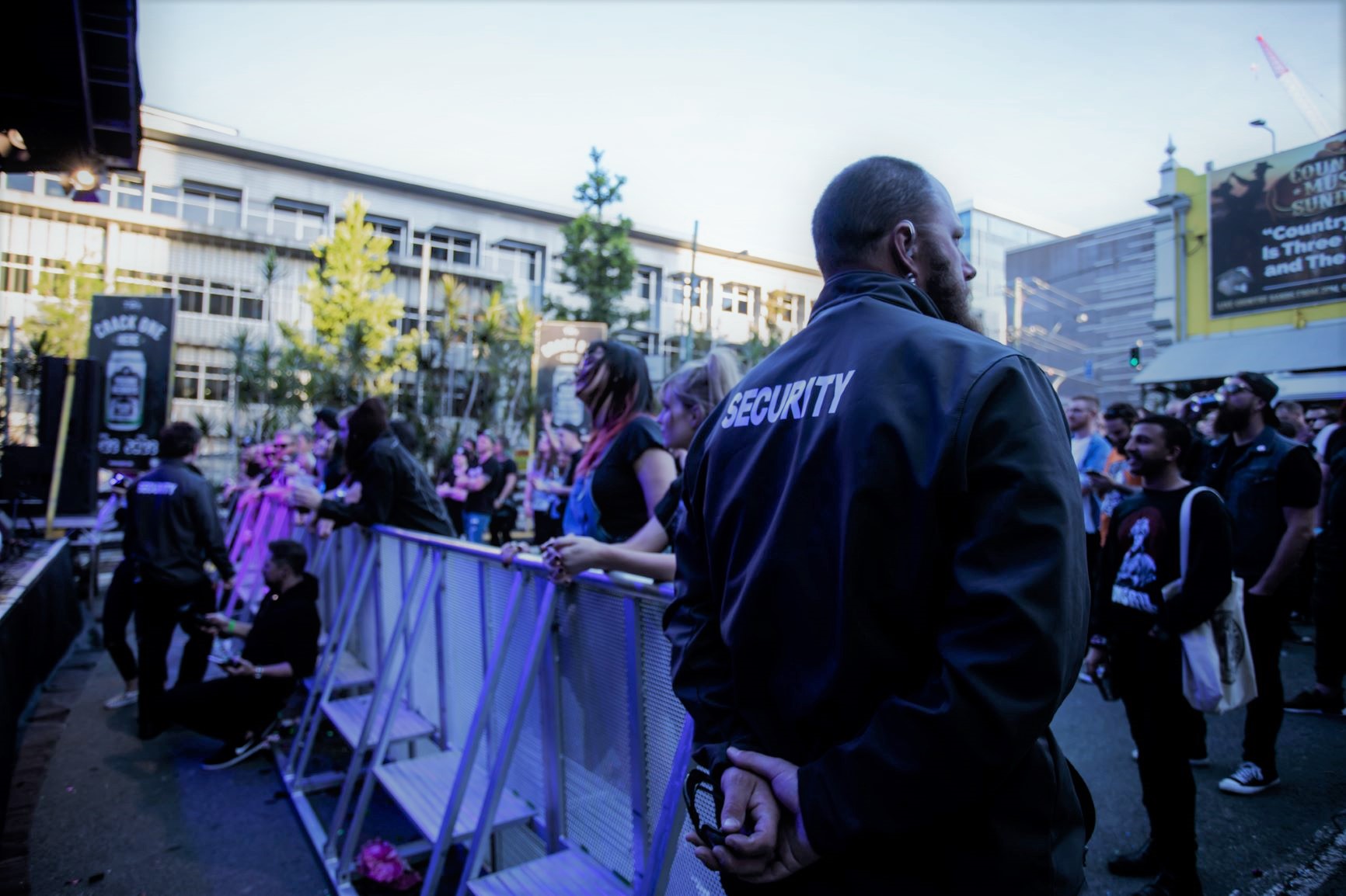 ANSIC officers behind crowd barriers at an outdoor event